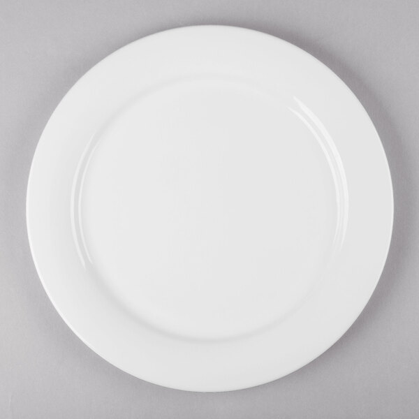 a white plate with a silver spoon