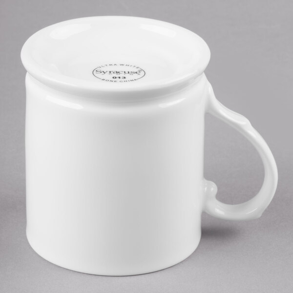 A white Reserve by Libbey bone china coffee mug with a handle.