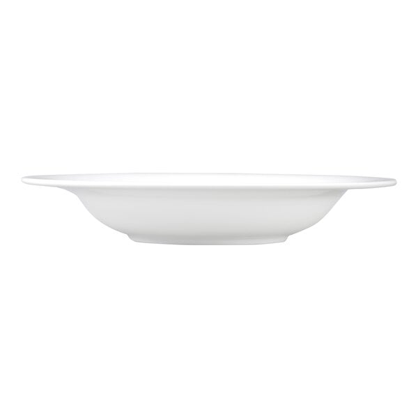 A side view of a plain white, round, shallow bowl with a wide rim.