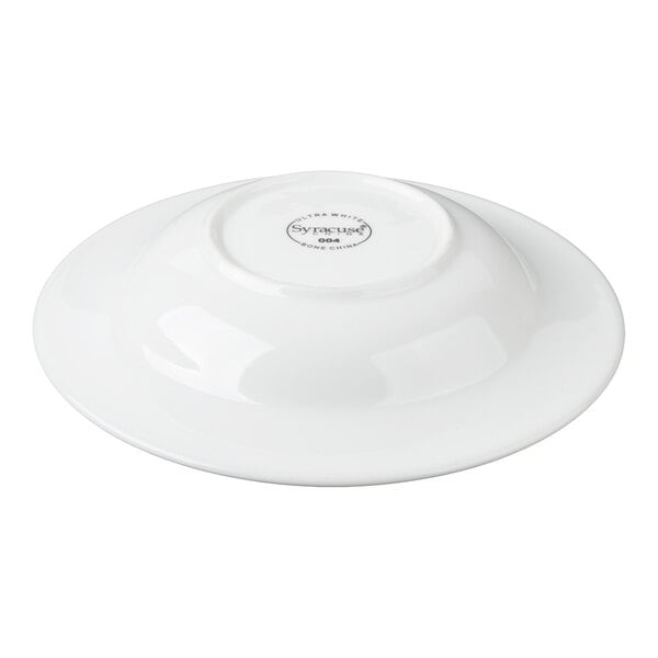 A white, round bowl shown upside down with a manufacturer's mark on the bottom.