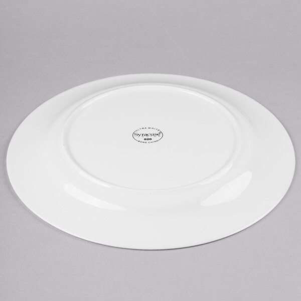 A white Reserve by Libbey bone china round plate with a circular design on the rim.