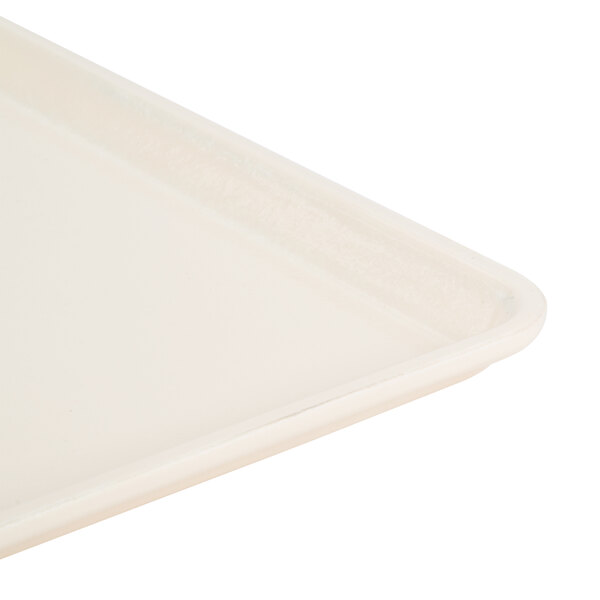 A close-up of a white Cambro dietary tray with a white edge.