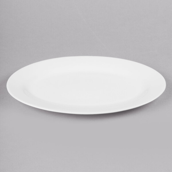 A white oval bone china platter with a white rim.