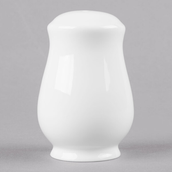 a white wall with a light reflecting off the wall