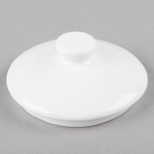 A white round object with a white lid with a round top.