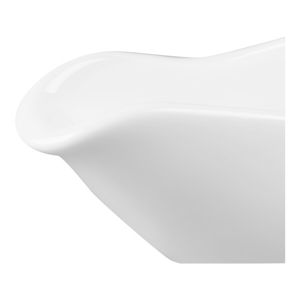 A close-up view of a white, glossy, curved ceramic or porcelain object, likely part of a dish or serving vessel.