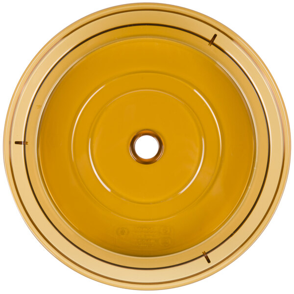 A yellow Cambro Camwear low profile plate cover with a hole in the center.