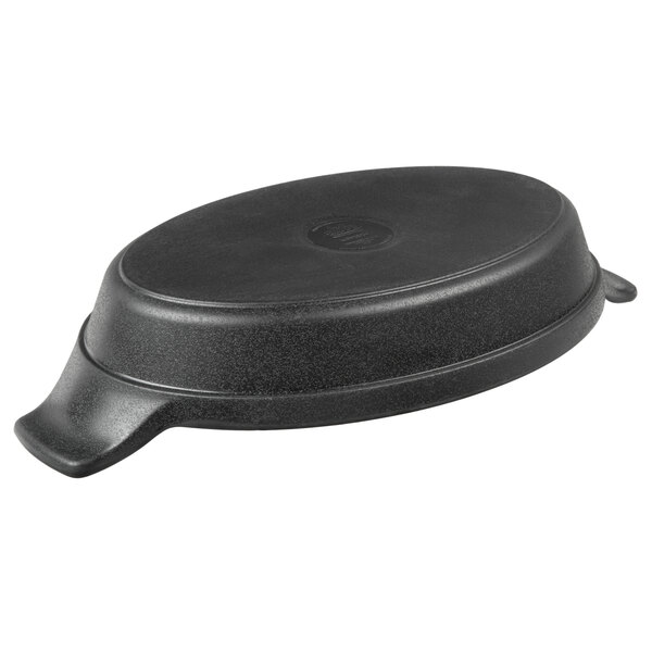 An Elite Global Solutions black faux cast iron oval skillet with handles and a black plastic lid.