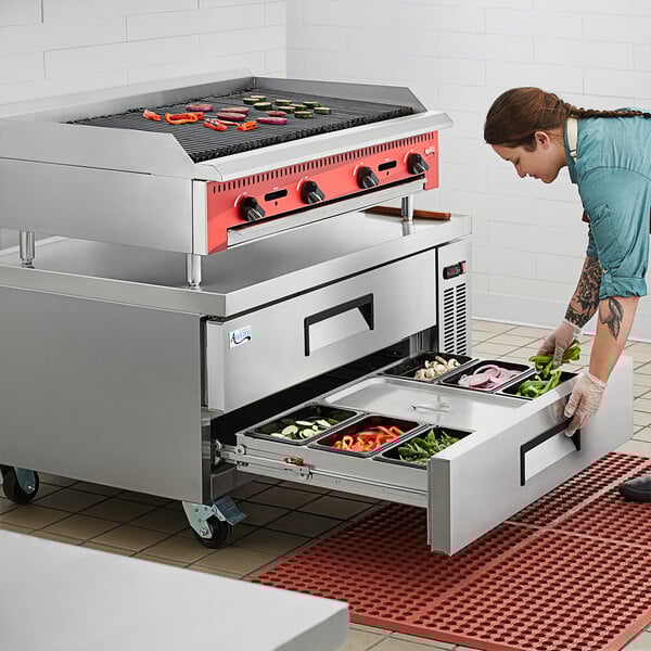 food on a grill with vegetables on it