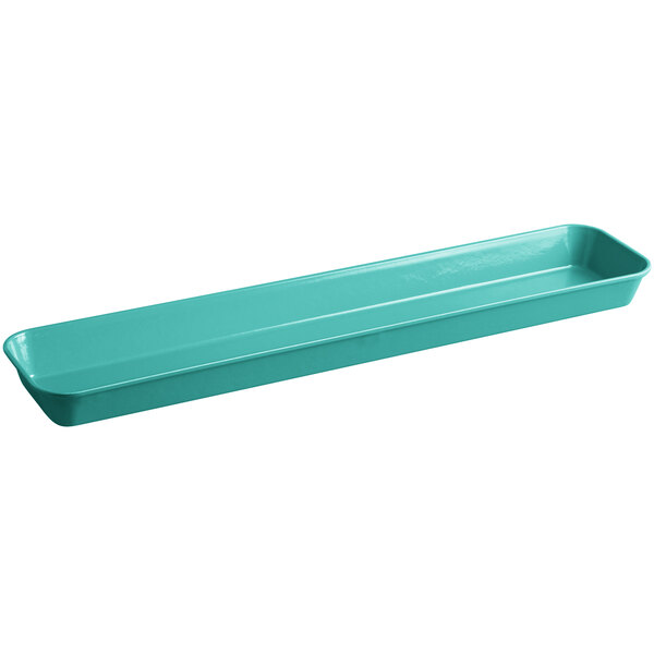 A green rectangular Cambro market pan on a counter.