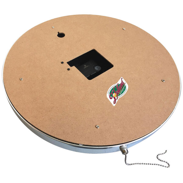 A circular object with a rectangular black frame and a UK logo in the center with a hole for a chain.