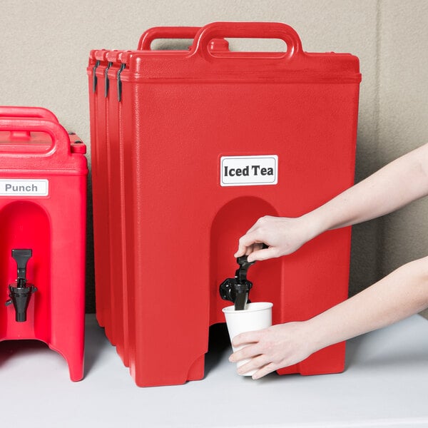 a black clip on a red plastic container