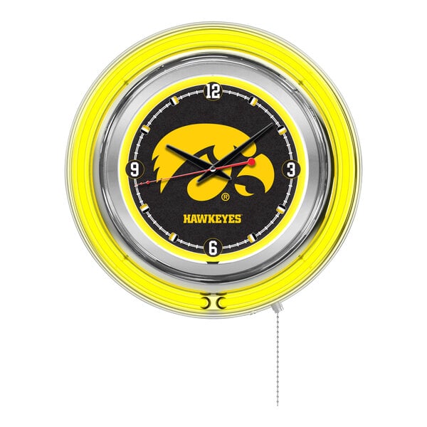 A round wall clock with a yellow neon border and the University of Iowa Hawkeyes logo in the center.
