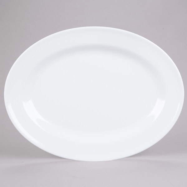 A white oval melamine platter with a white rim.