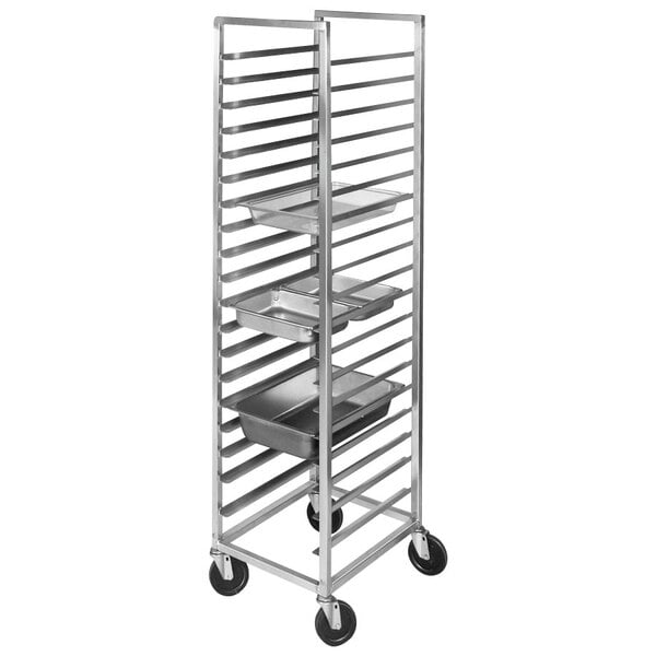 A Channel aluminum steam table pan rack with metal trays on shelves.