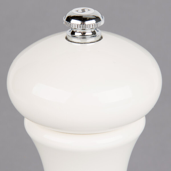 A Fletchers' Mill Marsala white pepper mill with a silver top.
