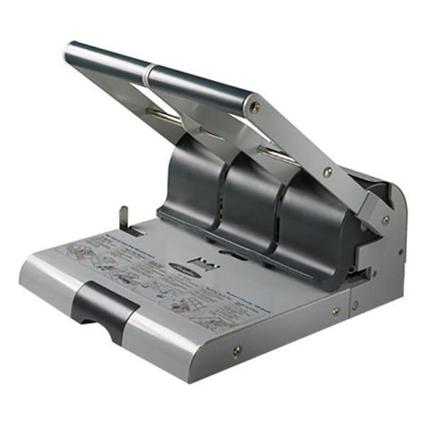 A close-up of a Swingline putty and gray hole puncher with 2 open pages being punched.