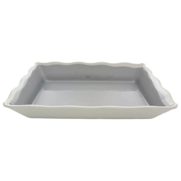A rectangular gray melamine tray with ivory wavy edges.