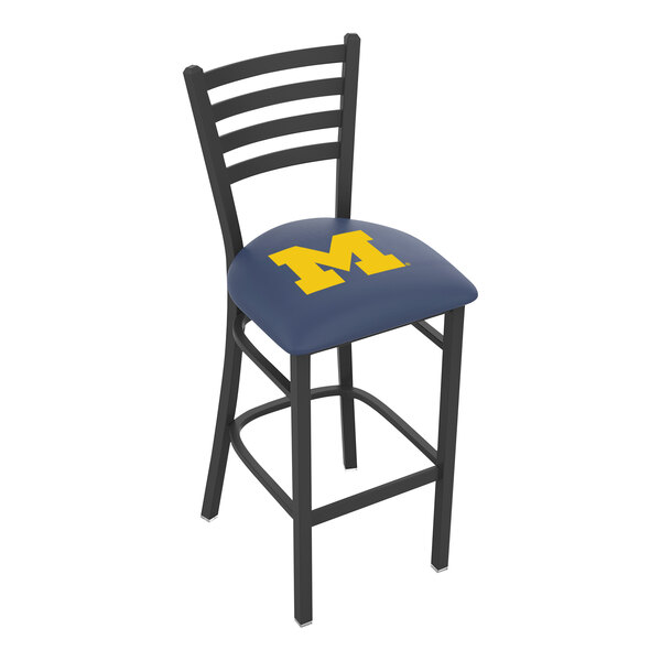 A black steel bar chair with a blue cushion and a yellow "M" on the back.