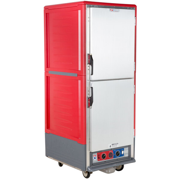 a red refrigerator with black handles