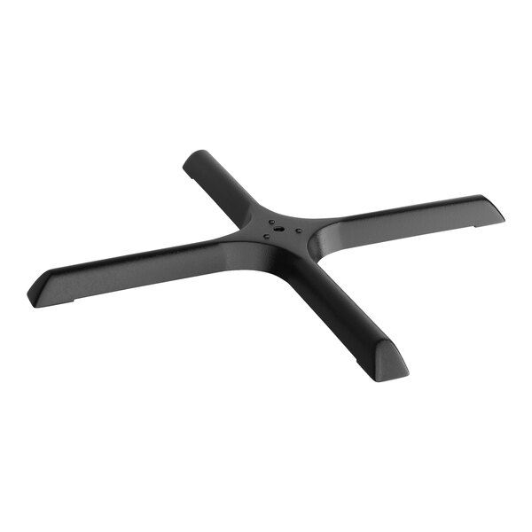 A black metal cross with four holes.