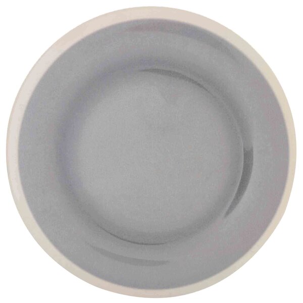 a white plate with a black handle