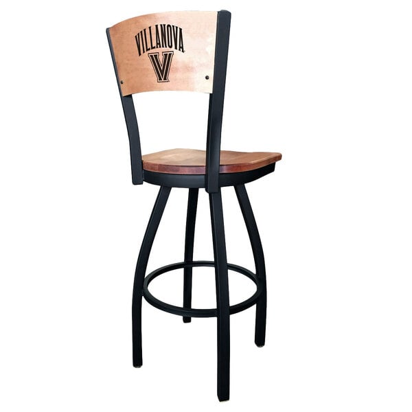 A black steel bar height swivel chair with a maple wood back and seat engraved with the Villanova University logo.