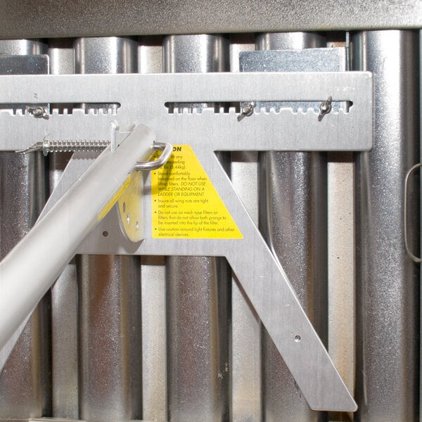 A metal bar with a yellow label.