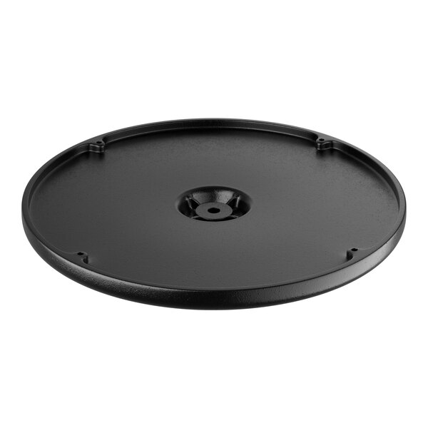 A black round plate with a hole in the center.