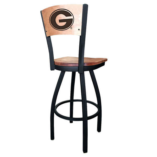 A black steel bar height chair with a University of Georgia Bulldog logo laser engraved on the maple wood seat and back.