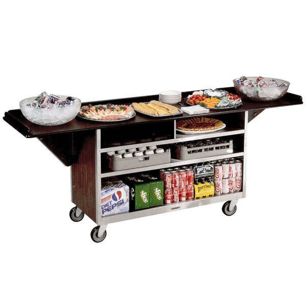 A Lakeside stainless steel beverage service cart with walnut vinyl finish holding food and drinks.