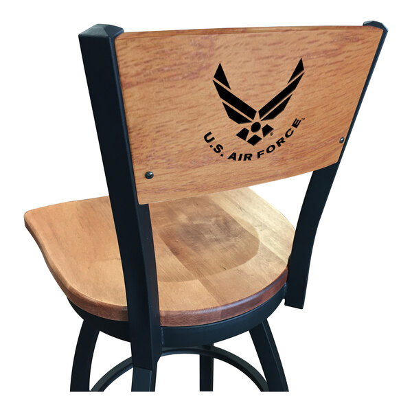 A black steel bar stool with a maple wood back and seat and the United States Air Force logo laser engraved.