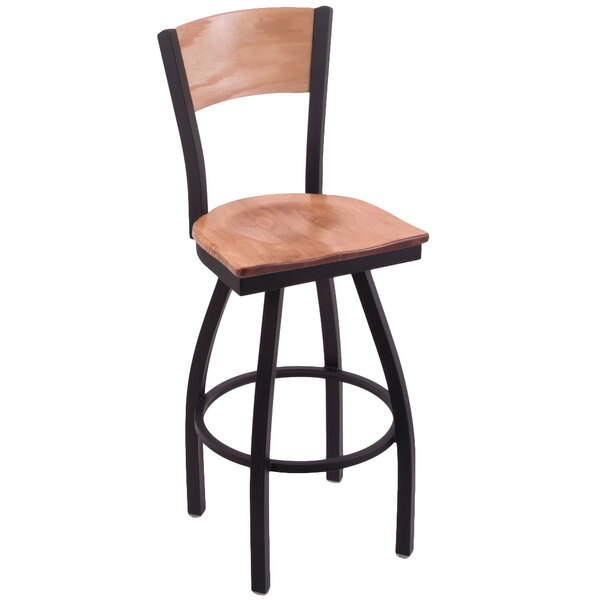 A black steel bar stool with a maple wood back and seat engraved with the University of Oklahoma logo.