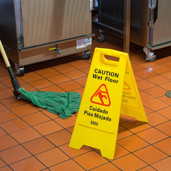 A wet floor sign posted to prevent falls