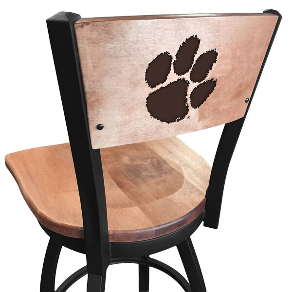 A black steel bar height swivel chair with maple back and seat engraved with "Clemson University" and a paw print.