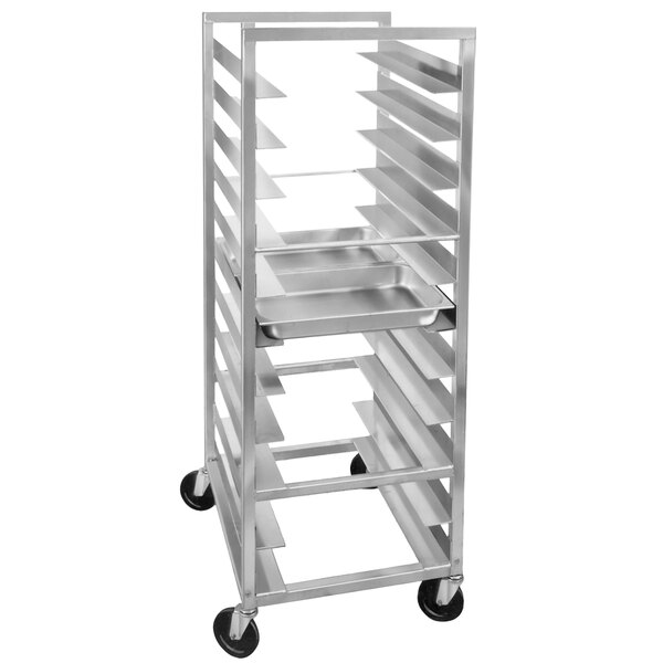 A Channel aluminum steam table pan rack with wheels holding metal trays.