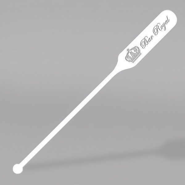 A white plastic paddle stirrer with a crown logo.
