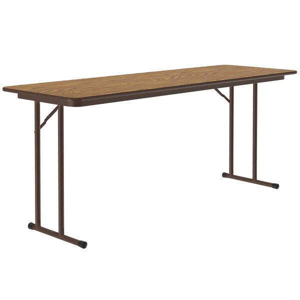 a brown rectangular table with metal legs