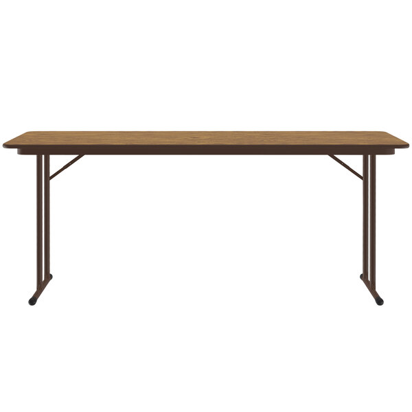 A medium oak rectangular Correll seminar table with off-set black legs.