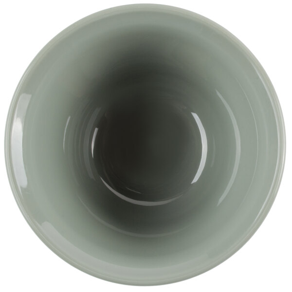 A close-up of a white Cambro insulated bowl with a green interior.