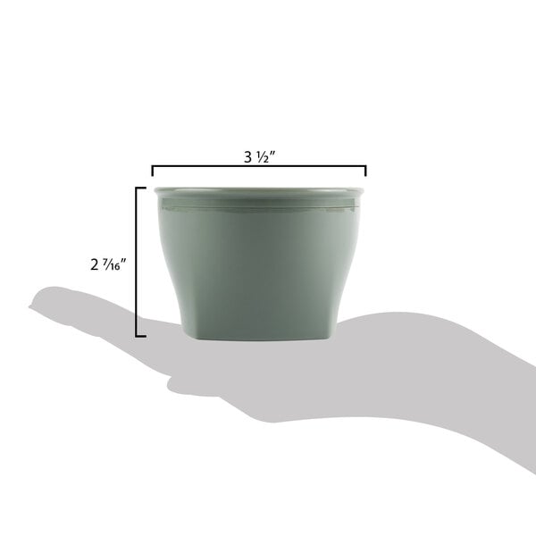 A hand holding a Cambro Harbor Collection Meadow insulated plastic bowl.
