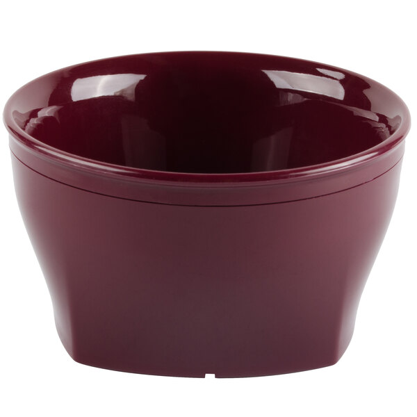 A red plastic bowl with a red lid on a white background.