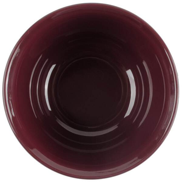 A close up of a red Cambro insulated bowl.