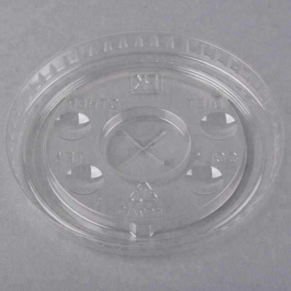 A clear plastic Fabri-Kal lid with flavor buttons and a straw slot.