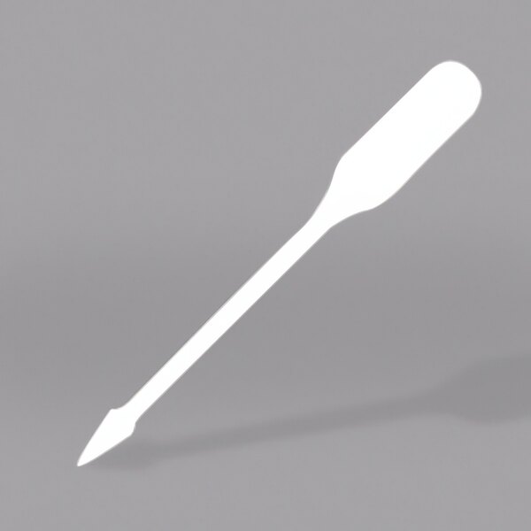 A white plastic WNA Comet Spirit paddle pick with a handle.