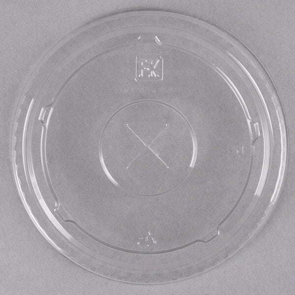 A clear Fabri-Kal plastic lid with a straw slot and a cross on it.