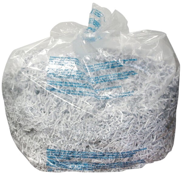 A close-up of a Swingline 30 gallon plastic shredder bag filled with shredded paper.