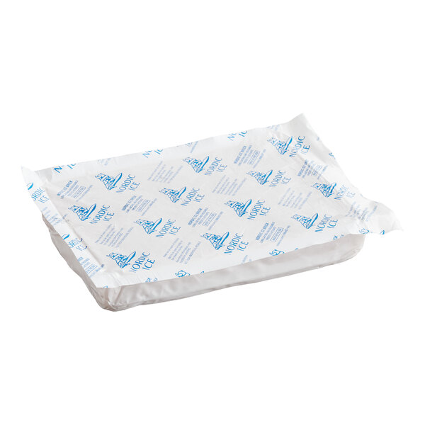 A rectangular Nordic Ice foam brick cold pack in a white and blue plastic wrapper.