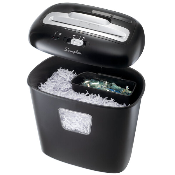 a black shredder with a black container full of shredded paper