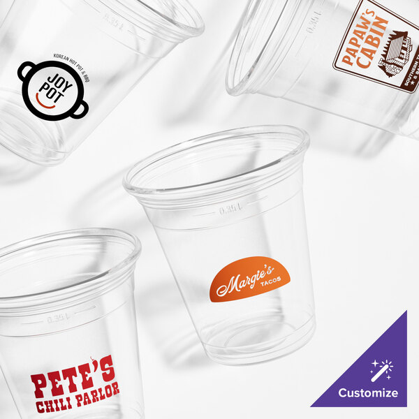 A group of clear Fabri-Kal plastic cups with a logo on one.
